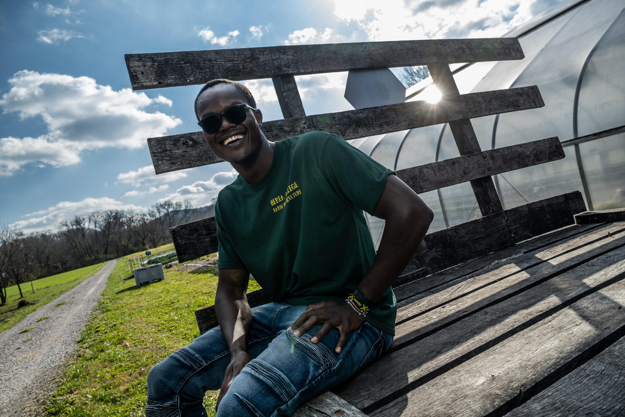 Agriculture student sitting outside at Berea College